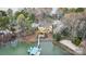 Aerial view of a luxurious lakeside home with a private dock and beautiful natural surroundings at 239 Paradise Peninsula Rd, Mooresville, NC 28117