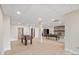 Finished basement featuring a foosball table, pool table, stone fireplace, and light wood flooring at 239 Paradise Peninsula Rd, Mooresville, NC 28117