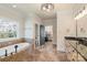 Lovely primary bathroom with a soaking tub, walk-in shower, and double sink vanity at 239 Paradise Peninsula Rd, Mooresville, NC 28117