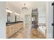 Luxurious primary bathroom with a jacuzzi tub, walk-in shower, and dual vanities at 239 Paradise Peninsula Rd, Mooresville, NC 28117