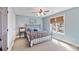 Comfortable bedroom featuring a metal bed frame, side table, and a bright window with wooden blinds at 239 Paradise Peninsula Rd, Mooresville, NC 28117