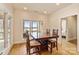 Bright dining room with lake view, hardwood floors, natural light, and a classic wooden dining set at 239 Paradise Peninsula Rd, Mooresville, NC 28117