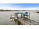 Covered boat dock on a lake showcasing boat storage at 239 Paradise Peninsula Rd, Mooresville, NC 28117