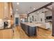 Open concept kitchen with a large island, stainless steel appliances, wood cabinets, and ample counter space at 239 Paradise Peninsula Rd, Mooresville, NC 28117