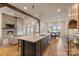 Open concept kitchen featuring a large island, stainless steel appliances, and seamless integration to dining area at 239 Paradise Peninsula Rd, Mooresville, NC 28117