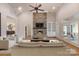 Comfortable living room featuring a stone fireplace, built-in shelving, and ample natural light at 239 Paradise Peninsula Rd, Mooresville, NC 28117