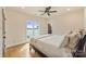 Comfortable bedroom with a lake view, hardwood floors, and an ensuite bathroom at 239 Paradise Peninsula Rd, Mooresville, NC 28117