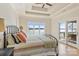 Bright main bedroom with beautiful lake views, tray ceilings, and access to the outdoors at 239 Paradise Peninsula Rd, Mooresville, NC 28117