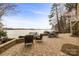 Scenic outdoor patio with stone flooring and partial lake view at 239 Paradise Peninsula Rd, Mooresville, NC 28117
