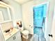 Cozy renovated bathroom with tiled floors, updated vanity, and shower-tub combo at 2906 Montford Nw Ave, Concord, NC 28027