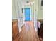 Inviting foyer showcasing hardwood floors, fresh paint, and bright blue entry door at 2906 Montford Nw Ave, Concord, NC 28027