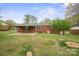 Backyard with an attached patio and landscaping at 303 Windy Rush Rd, Kannapolis, NC 28081
