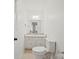 Cozy half bath with a modern vanity, granite countertop, and stylish fixtures at 303 Windy Rush Rd, Kannapolis, NC 28081