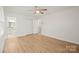 Bedroom featuring wood floors, lots of closet space, and modern paint at 303 Windy Rush Rd, Kannapolis, NC 28081
