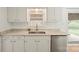 Kitchen featuring white cabinets, modern granite countertops, and stainless steel appliances at 303 Windy Rush Rd, Kannapolis, NC 28081