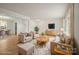 Bright living room featuring neutral furniture, a patterned rug, and a mounted TV for comfortable living at 303 Windy Rush Rd, Kannapolis, NC 28081