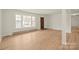 Bright living space featuring wood floors, a large window, and ample natural light at 303 Windy Rush Rd, Kannapolis, NC 28081