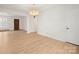 Bright living room features beautiful floors and natural light from the front door at 303 Windy Rush Rd, Kannapolis, NC 28081