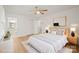 Bright main bedroom with a ceiling fan, closet, en suite bathroom, and plush bedding at 303 Windy Rush Rd, Kannapolis, NC 28081