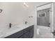 Bathroom featuring double sinks with a sleek vanity and modern fixtures, plus a shower/tub combination at 3129 Rush Ave, Charlotte, NC 28208