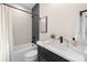 Stylish bathroom with marble countertop, black fixtures, and a modern shower at 3129 Rush Ave, Charlotte, NC 28208