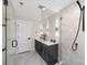 Sleek bathroom boasts double vanity, glass-enclosed shower, and modern fixtures at 3129 Rush Ave, Charlotte, NC 28208