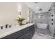 Modern bathroom featuring a double vanity, stand alone tub, and sleek glass shower at 3129 Rush Ave, Charlotte, NC 28208