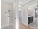 Hallway featuring laundry area and partial view of a modern bathroom at 3129 Rush Ave, Charlotte, NC 28208