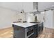 Kitchen island featuring a gas stovetop, stainless steel appliances, and modern cabinetry at 3129 Rush Ave, Charlotte, NC 28208