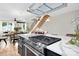 Close-up of the kitchen island with a stainless-steel gas cooktop and open floor plan at 3129 Rush Ave, Charlotte, NC 28208
