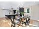Modern kitchen featuring a large island with bar seating and stylish black cabinetry at 3129 Rush Ave, Charlotte, NC 28208