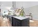 Stylish kitchen island with marble countertops, stainless steel appliances, and a modern vent hood at 3129 Rush Ave, Charlotte, NC 28208