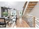 Bright, open-concept living space with modern staircase, hardwood floors, and sleek furnishings at 3129 Rush Ave, Charlotte, NC 28208