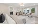 Bright and airy main bedroom with windows, furnishings, and an en-suite bathroom at 3129 Rush Ave, Charlotte, NC 28208