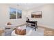 Cozy home office with a large window, modern desk, and comfortable seating area at 3129 Rush Ave, Charlotte, NC 28208