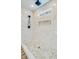 Elegant walk-in shower with white marble-like tile walls and a decorative tile floor at 32519 Buchanan Ln, Albemarle, NC 28001