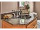Close-up of bathroom vanity featuring marble countertop and silver faucet at 338 Fairfield Ct, Mount Gilead, NC 27306