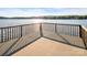 Lake view from deck showcasing the calm water and distant shoreline from a wooden deck with railing at 338 Fairfield Ct, Mount Gilead, NC 27306