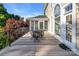 Expansive wooden deck features an outdoor dining set, screens in porch, and manicured landscaping at 338 Fairfield Ct, Mount Gilead, NC 27306
