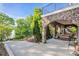 Exterior view of a stone patio with a view of the backyard, lake and horizon at 338 Fairfield Ct, Mount Gilead, NC 27306