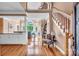 Inviting foyer showcasing hardwood floors, staircase, and a view into the spacious living area at 338 Fairfield Ct, Mount Gilead, NC 27306