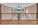 Second story foyer featuring hardwood floors, white banister, and multiple windows at 338 Fairfield Ct, Mount Gilead, NC 27306