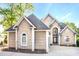 Beautiful front exterior of a home featuring shingle siding, arched windows, and a well-manicured lawn at 338 Fairfield Ct, Mount Gilead, NC 27306