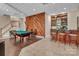 Entertaining game room features a bar, a billiards table, and an eye-catching wood paneled accent wall at 338 Fairfield Ct, Mount Gilead, NC 27306