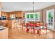 Eat-in kitchen featuring bar stool seating, wood cabinets, and an adjacent dining area at 338 Fairfield Ct, Mount Gilead, NC 27306