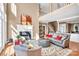 Bright, open-concept living room featuring a fireplace, comfortable seating, and elegant decor at 338 Fairfield Ct, Mount Gilead, NC 27306