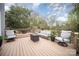Spacious wooden deck, great for entertaining, featuring comfortable seating and a wooded view at 3409 Pondview Ln, Charlotte, NC 28210