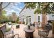 Inviting back deck offers outdoor seating and a cozy fire pit, perfect for entertaining and relaxation at 3409 Pondview Ln, Charlotte, NC 28210