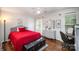 Charming bedroom with hardwood floors, a comfy bed, and a quaint work-from-home station at 3409 Pondview Ln, Charlotte, NC 28210