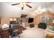 Spacious bonus room with multiple ceiling fans, carpeted floors, and plenty of natural light at 3409 Pondview Ln, Charlotte, NC 28210